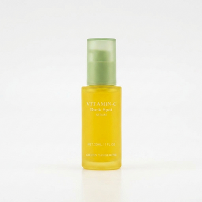 Yellow bottle with green cap on a white background
